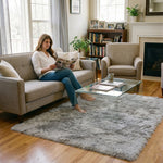 Faux fur sheepskin rug on a closet floor with a woman standing barefoot while reaching for a hanger