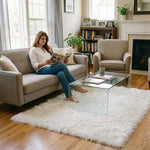 Faux fur sheepskin rug on a closet floor with a woman standing barefoot while reaching for a hanger