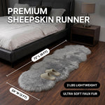 Faux fur sheepskin rug runner at the foot of a bed, labeled 72 inches long by 24 inches wide with slippers resting on top