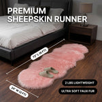 Faux fur sheepskin rug runner at the foot of a bed, labeled 72 inches long by 24 inches wide with slippers resting on top
