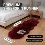 Faux fur sheepskin rug runner at the foot of a bed, labeled 72 inches long by 24 inches wide with slippers resting on top