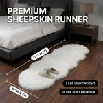 Faux fur sheepskin rug runner at the foot of a bed, labeled 72 inches long by 24 inches wide with slippers resting on top