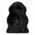 Faux fur sheepskin rug in white and yellow, shown flat from above in its natural pelt shape