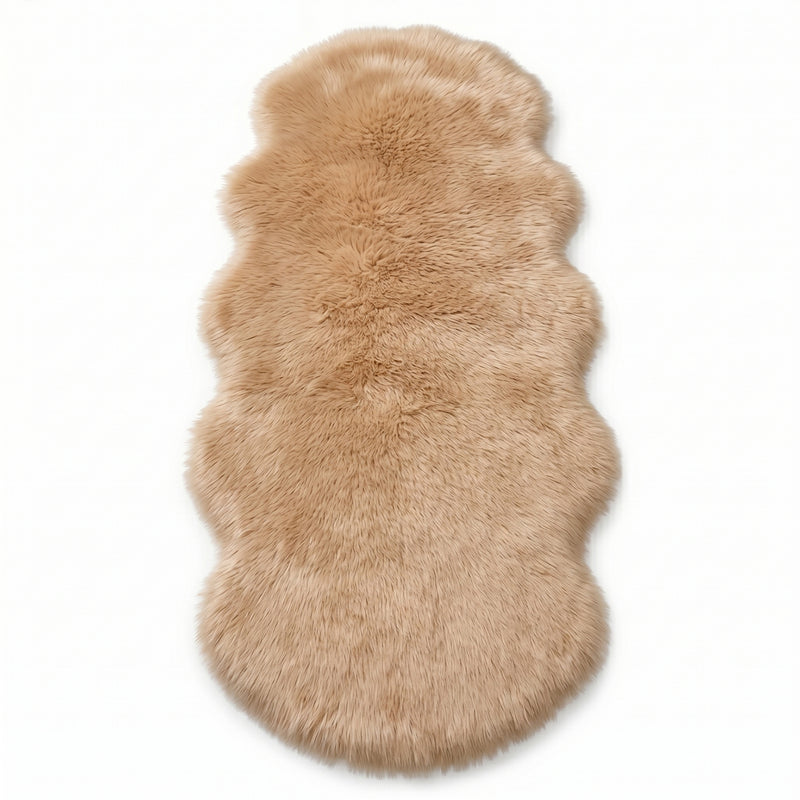 Faux fur sheepskin rug in white and yellow, shown flat from above in its natural pelt shape