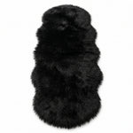 Faux fur sheepskin rug in white and yellow, shown flat from above in its natural pelt shape