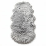 Faux fur sheepskin rug in white and yellow, shown flat from above in its natural pelt shape