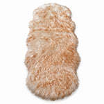 Faux fur sheepskin rug in white and yellow, shown flat from above in its natural pelt shape