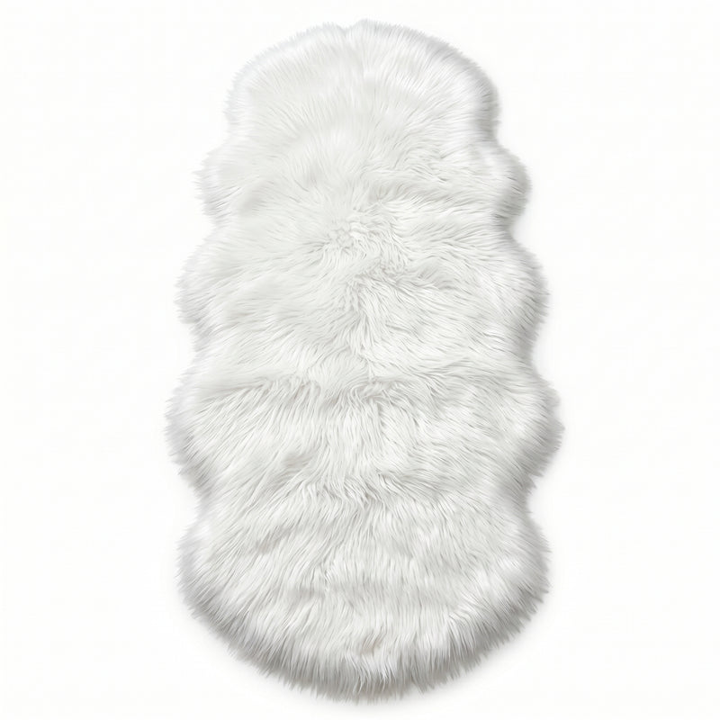 Faux fur sheepskin rug in white and yellow, shown flat from above in its natural pelt shape