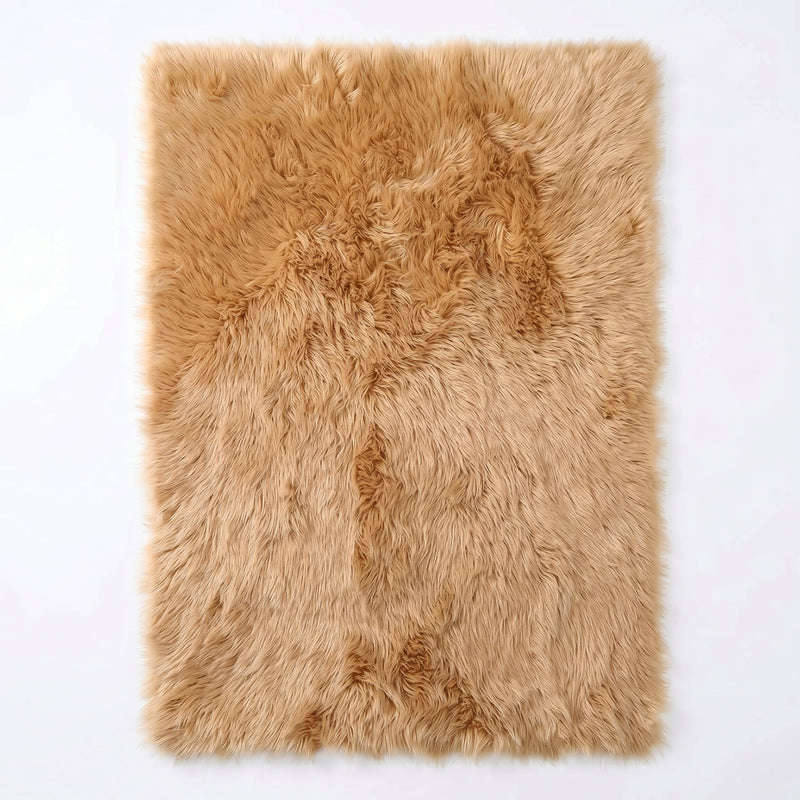 Faux fur sheepskin rug in white and yellow, shown flat from above in its natural pelt shape