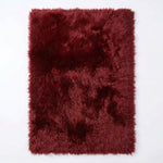 Faux fur sheepskin rug in white and yellow, shown flat from above in its natural pelt shape