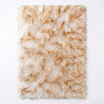 Faux fur sheepskin rug in white and yellow, shown flat from above in its natural pelt shape