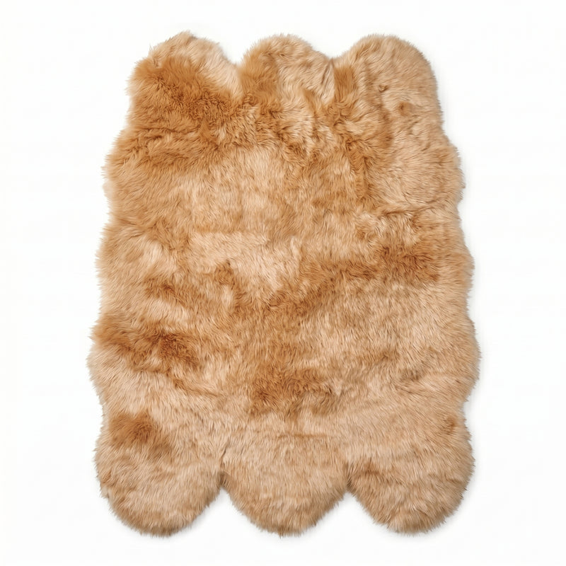 Faux fur sheepskin rug in white and yellow, shown flat from above in its natural pelt shape