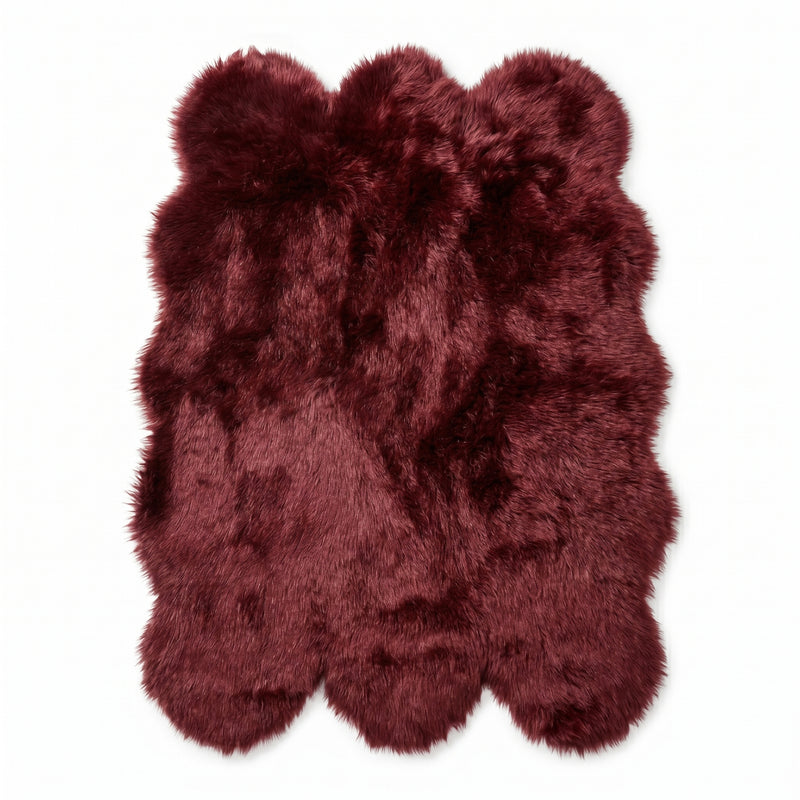 Faux fur sheepskin rug in white and yellow, shown flat from above in its natural pelt shape
