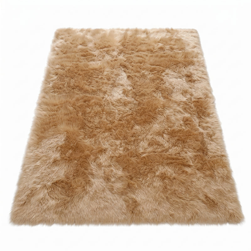 Faux fur sheepskin rug in white and yellow, shown flat from above in its natural pelt shape