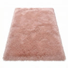 Faux fur sheepskin rug in white and yellow, shown flat from above in its natural pelt shape
