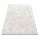 Faux fur sheepskin rug in white and yellow, shown flat from above in its natural pelt shape