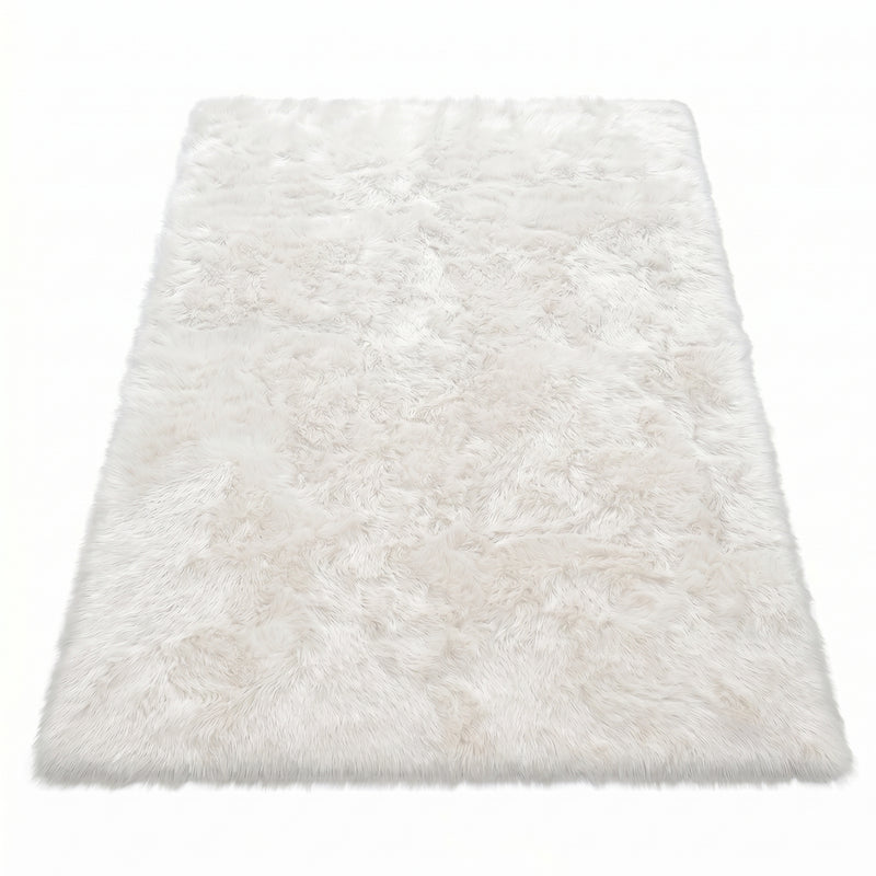 Faux fur sheepskin rug in white and yellow, shown flat from above in its natural pelt shape