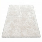 Faux fur sheepskin rug in white and yellow, shown flat from above in its natural pelt shape
