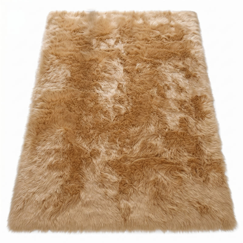 Faux fur sheepskin rug in white and yellow, shown flat from above in its natural pelt shape