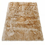Faux fur sheepskin rug in white and yellow, shown flat from above in its natural pelt shape