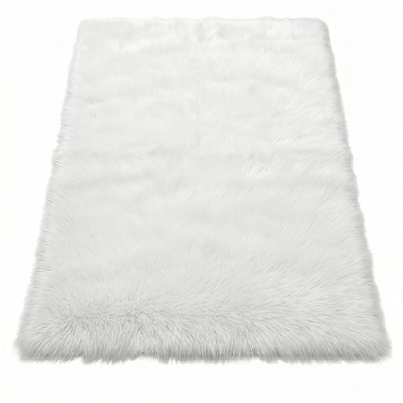 Faux fur sheepskin rug in white and yellow, shown flat from above in its natural pelt shape