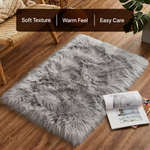 White fluffy faux sheepskin rug in bedroom beside bed — bedside rug placement