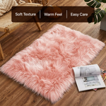 White fluffy faux sheepskin rug in bedroom beside bed — bedside rug placement
