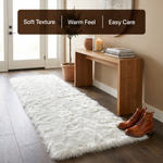 White fluffy faux sheepskin rug in bedroom beside bed — bedside rug placement
