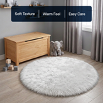 White fluffy faux sheepskin rug in bedroom beside bed — bedside rug placement