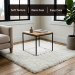White fluffy faux sheepskin rug in bedroom beside bed — bedside rug placement