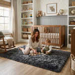 Ultra-soft faux sheepskin area rug in white placed in living room beside armchair