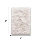 Faux sheepskin fluffy area rug detail shot showing non-slip suede backing