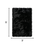 Faux sheepskin fluffy area rug detail shot showing non-slip suede backing