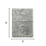 Faux sheepskin fluffy area rug detail shot showing non-slip suede backing