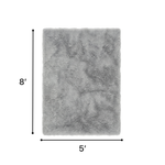Faux sheepskin fluffy area rug detail shot showing non-slip suede backing