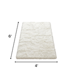 Faux sheepskin fluffy area rug detail shot showing non-slip suede backing