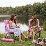 Woman relaxing in a low folding beach chair at the beach
