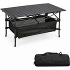 Black aluminum folding camping table with roll-up top and mesh storage basket
