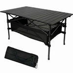 Black aluminum folding camping table with roll-up top and mesh storage basket