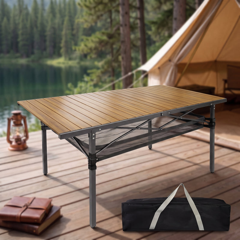 Black aluminum folding camping table with roll-up top and mesh storage basket