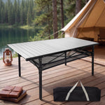 Black aluminum folding camping table with roll-up top and mesh storage basket