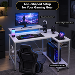Close-up of the RGB LED strip under the monitor shelf showing multiple lighting modes and colors
