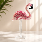 Hand-blown pink glass flamingo figurine with curved neck in sitting pose
