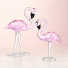 Hand-blown pink glass flamingo figurine with curved neck in sitting pose