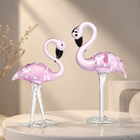 Hand-blown pink glass flamingo figurine with curved neck in sitting pose