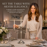 Gold candelabra with three lit taper candles on a styled formal dining table