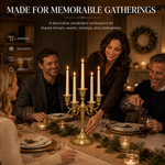 People gathered at a formal dinner table with a lit gold candelabra centerpiece