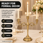 Lit white taper candles in a gold candelabra styled for formal décor