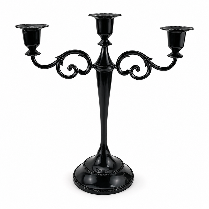 Gold three-arm metal candelabra candle holder on a white background