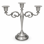 Gold three-arm metal candelabra candle holder on a white background
